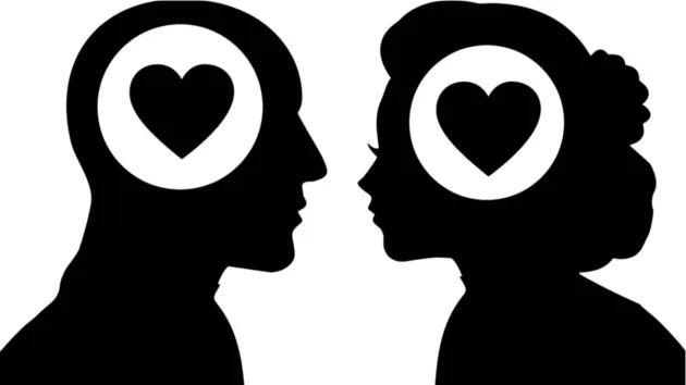 silueta hombre y mujer mirándose con corazón